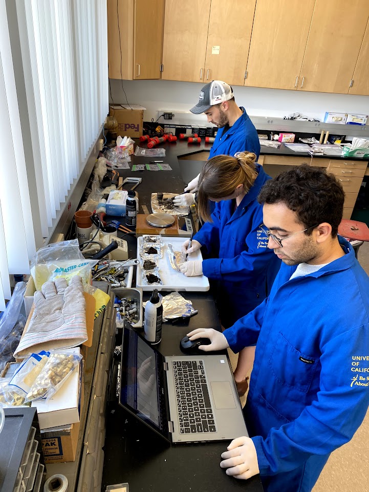 KCCAMS undergraduate researchers weighing and preparing soil samples