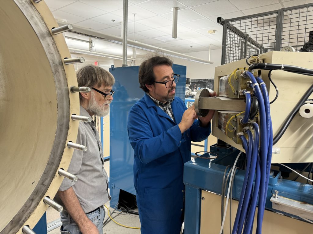 KCCAMS staff working on opened spectrometer